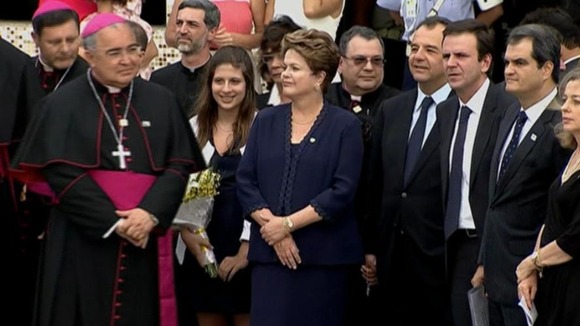 Brazil's president Dilma Rousseff waiting to greet the pontiff on the tarmac of Rio de Janeiro's airport.