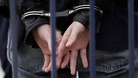 A man in handcuffs.