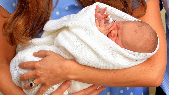 he safe hands of the Duchess of Cambridge with her son