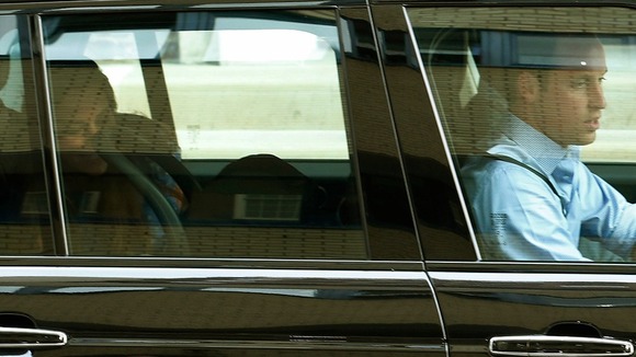 The Duchess of Cambridge smiles at her son as they leave the hospital.