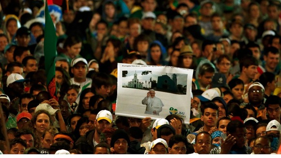 An estimated half million Roman Catholic faithful braved the rain and crowded onto Copacabana beach.