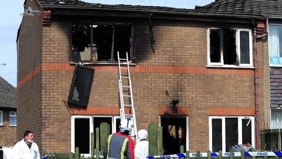 Emergency services attend the scene of a house fire in Buxton, Derbyshire, in which two young children died.