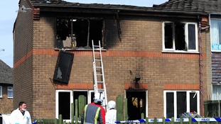 Emergency services attend the scene of a house fire in Buxton, Derbyshire, in which two young children died.