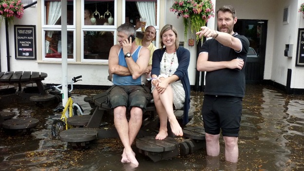 Patrons in the car park of The Grosvenor pub in Nottingham as a sudden flash flood left a road side pub flooded with rainwater.