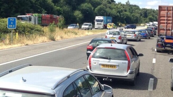 Traffic queues as police divert cars following a minibus crash on the M3