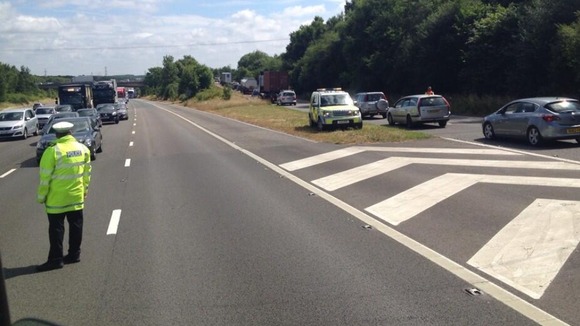 Traffic queues as police divert cars following a minibus crash on the M3