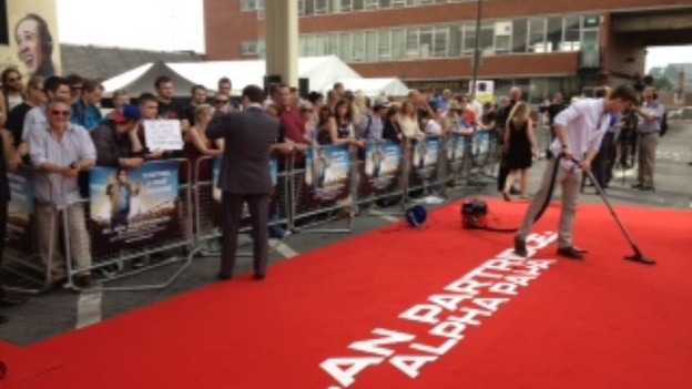 The red carpet being hovered ready for Alan Partridge