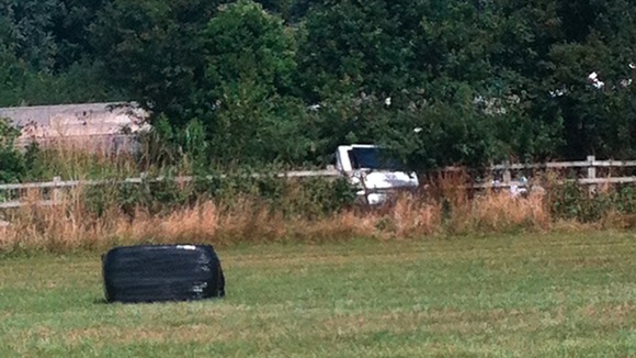 Minibus in a field after it crashed on the M3