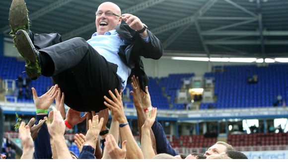 Reading's Manager Brian McDermott is held aloft by his players.