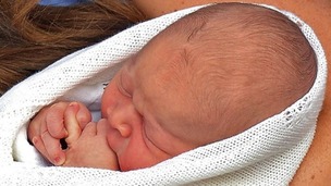 Prince George in his mother's arms yesterday evening.