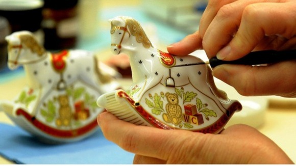Julie Scott puts the final touches on a Rocking Horse, a souvenir to commemorate the birth of the royal baby.