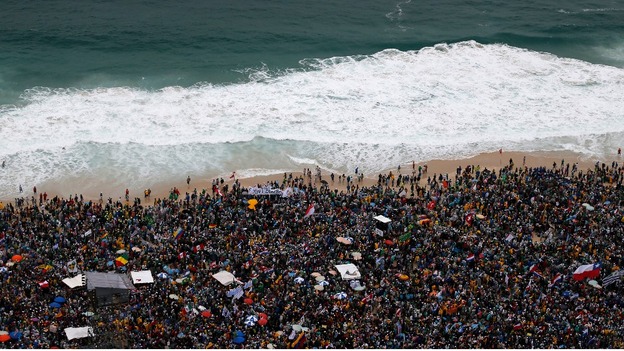 Lifeguards patrol offshore as Roman Catholics await the arrival of Pope Francis on Rio's Copacabana beach.