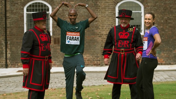 Olympic champions Mo Farah and Jessica Ennis-Hill pose for pictures at the Tower of London.