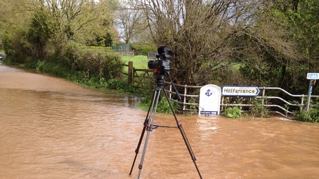 camera on tripod on flooded road near Hillfarrance