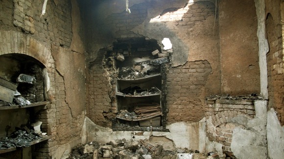 Burnt rooms inside the prison after the midnight raid.