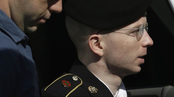 Bradley Manning is escorted into court in Fort Meade, Maryland.