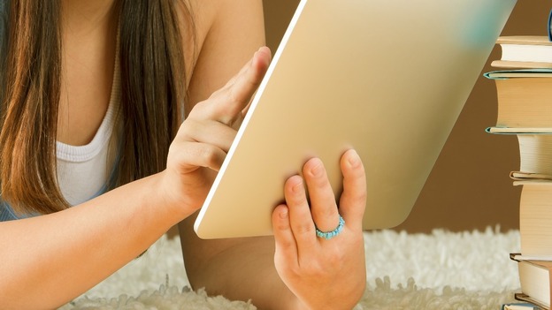 A girl using a tablet computer.