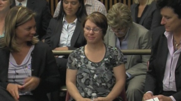 Michelle Knight smiles as Castro is led from court.