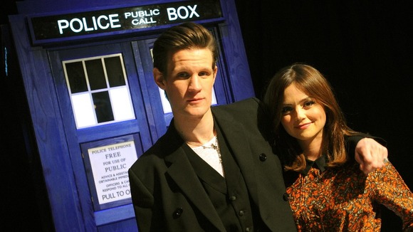 Matt Smith and Jenna-Louise Coleman in front of a Tardis.