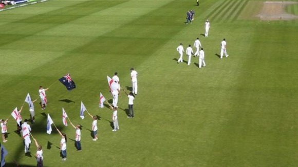 England cricketers walk onto the pitch at Old Trafford in Manchester