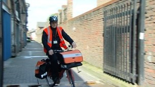 TNT postman on a cycle 