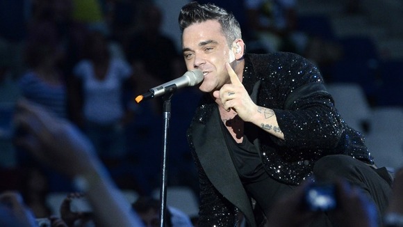 Robbie Williams performing during a solo concert