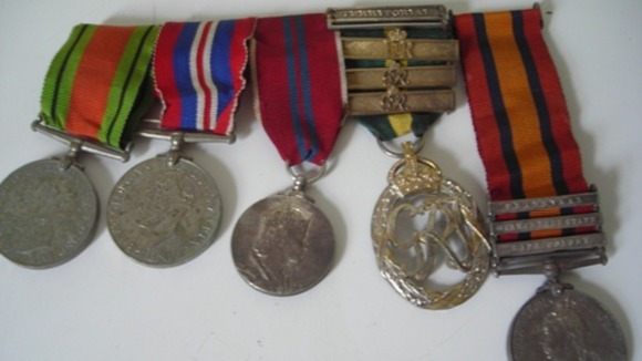 Five medals found by the roadside in Bacton