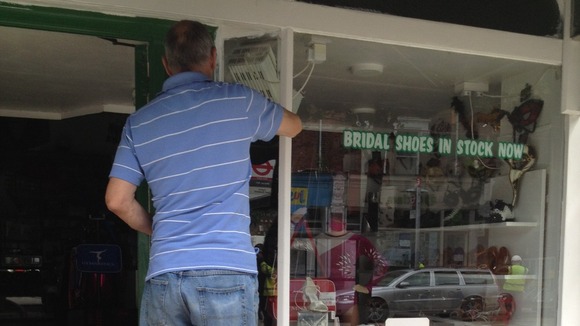 A local business owner works on his shop