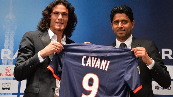 Paris Saint-Germain's new forward Edinson Cavani and chairman Nasser Al-Khelaifi.