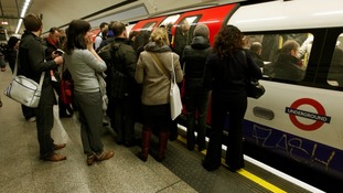 File photo of commuters on a tube