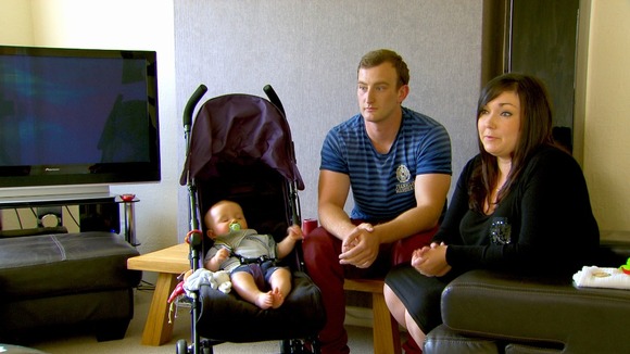 Family sitting in living room