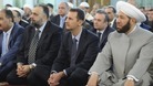 President Assad pictured praying after oppositions claims it shelled his motorcade.