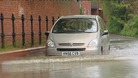 A car takes on the floods earlier today