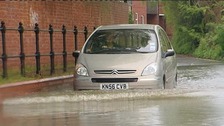 A car takes on the floods earlier today