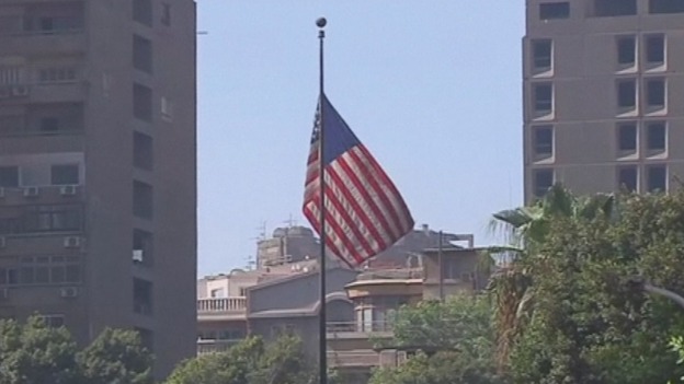 The US flag flies over its embassy in Cairo as it reopens following security concerns.