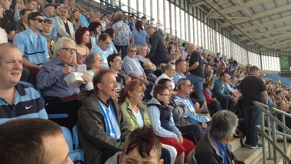 Football fans fill the stands at the Ricoh Arena for legends match
