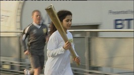 Girl running with Olympic torch