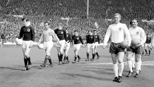 The two team walk out onto the pitch at Wembley Stadium in 1967. Scotland would go on to beat the World Champions 3-2.