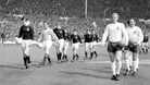 The two team walk out onto the pitch at Wembley Stadium in 1967. Scotland would go on to beat the World Champions 3-2.