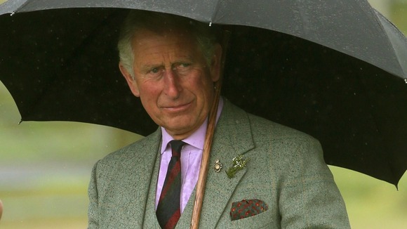 The Prince of Wales judges the Tug of War as Chieftain of the Mey Highland Games.