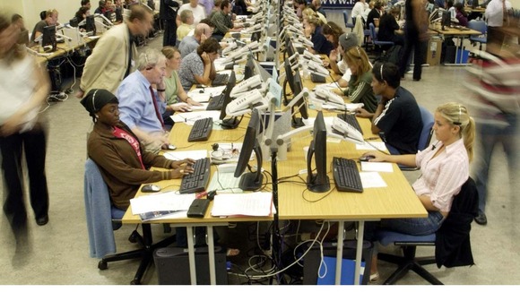 Phone operators take calls in the Clearing centre at London South Bank University
