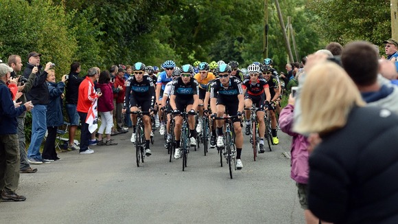 Bradley Wiggins and Team Sky leads a group of cyclists through the Peak District