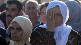 Palestinian families wait to receive the news of whether their loved ones will be freed