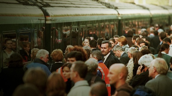 Rail passengers at Ealing train station in west London