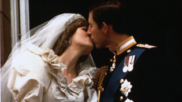 Prince Charles kisses his new bride Diana on their wedding day July 29, 1981