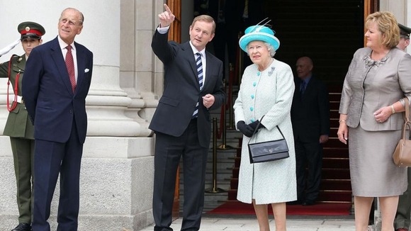 The Queen listens to Ireland's PM Enda Kenny watched by Prince Philip and Kenny's wife Fionnuala