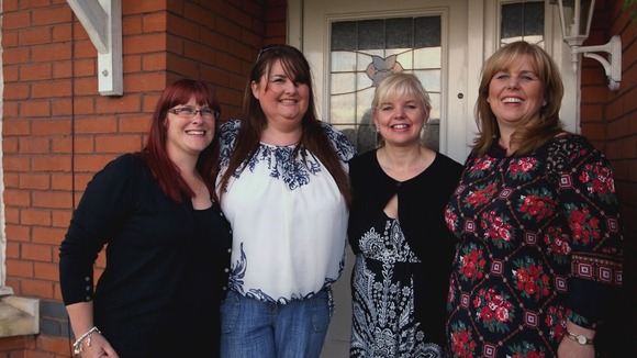 4 ladies stood in a row