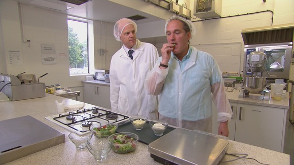 Man testing food in lab-like kitchen