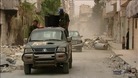 Pro-Assad forces patrol Syria's third largest city of Homs