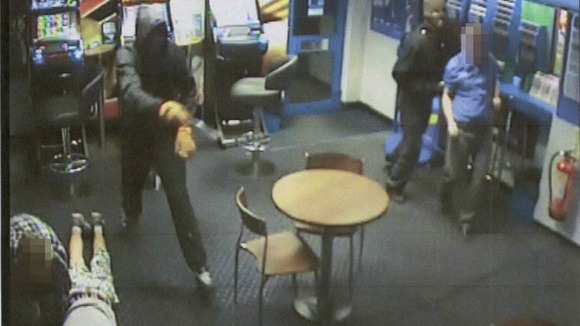 CCTV image of an armed robbery at Coral bookmakers, High Street, Chesterton, Cambridge.